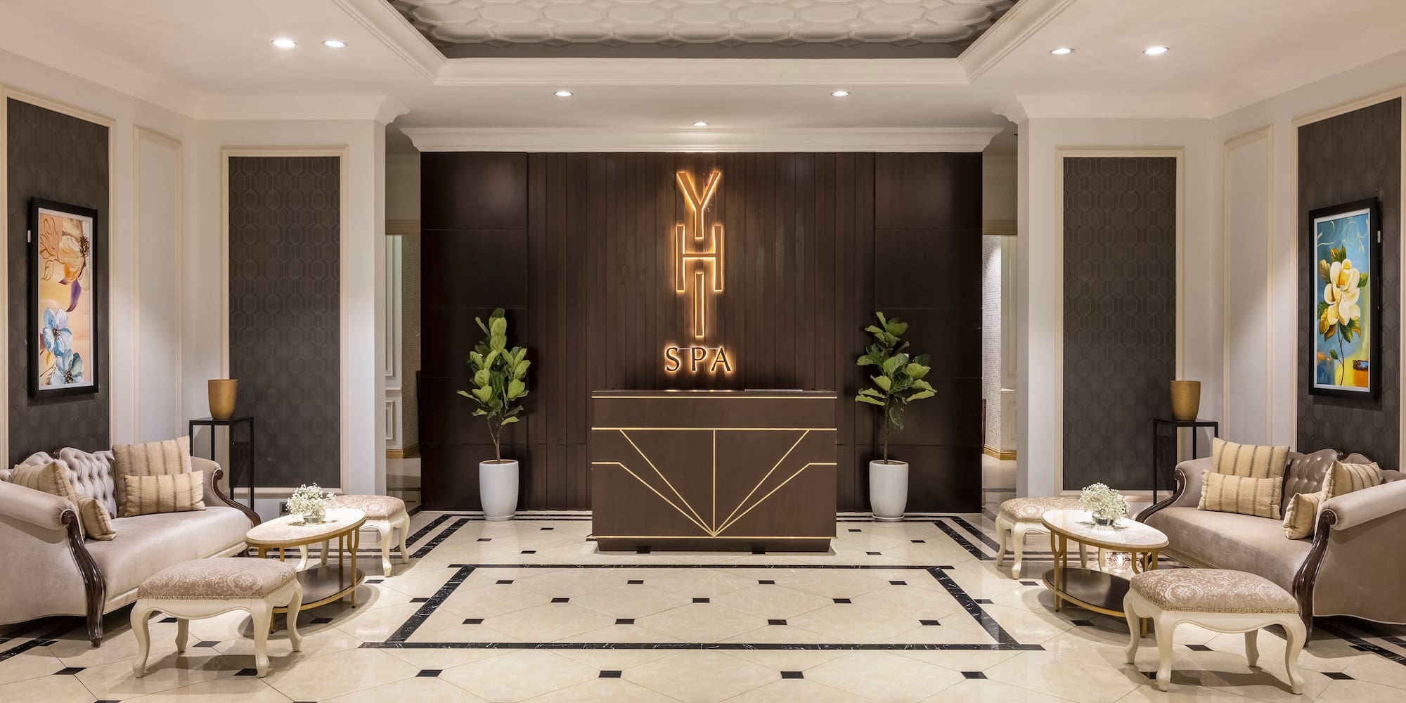 a room with a reception desk and chairs