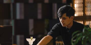 a man standing at a bar