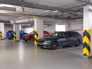 a group of cars parked in a parking garage