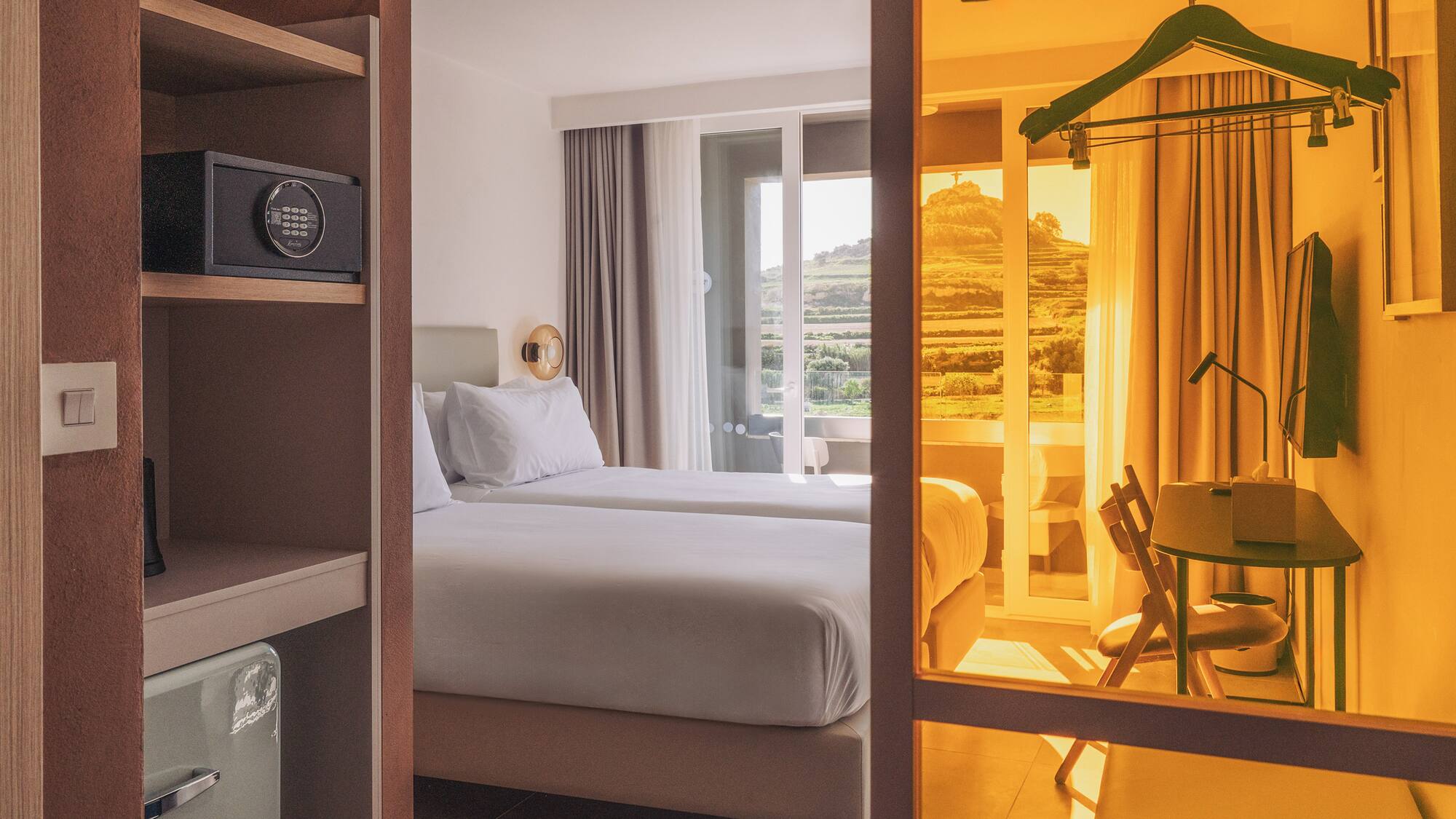 a room with two beds and a closet