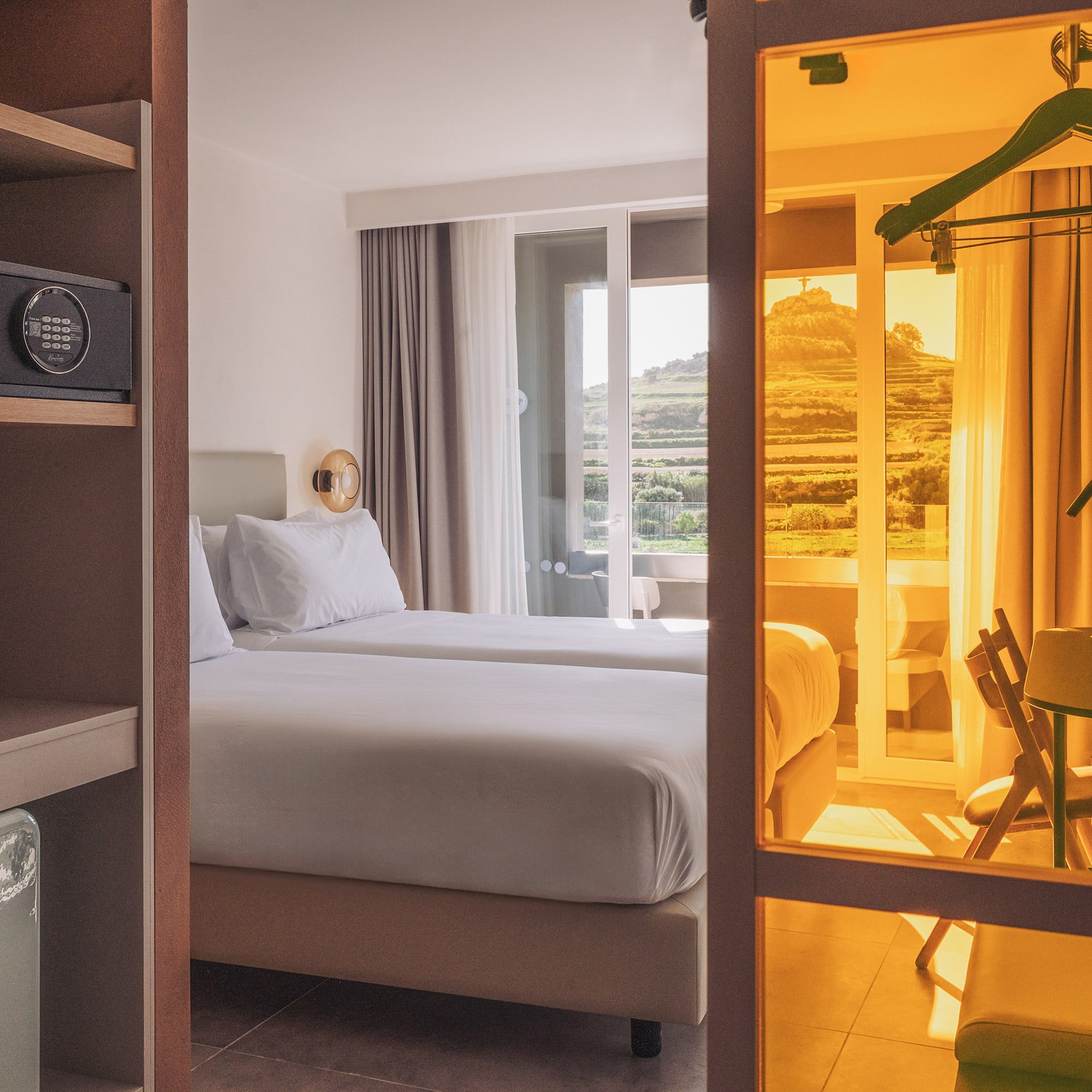 a room with two beds and a closet