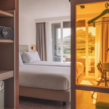 a room with two beds and a closet