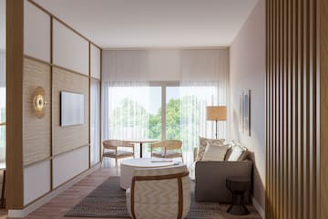 a living room with a table and chairs