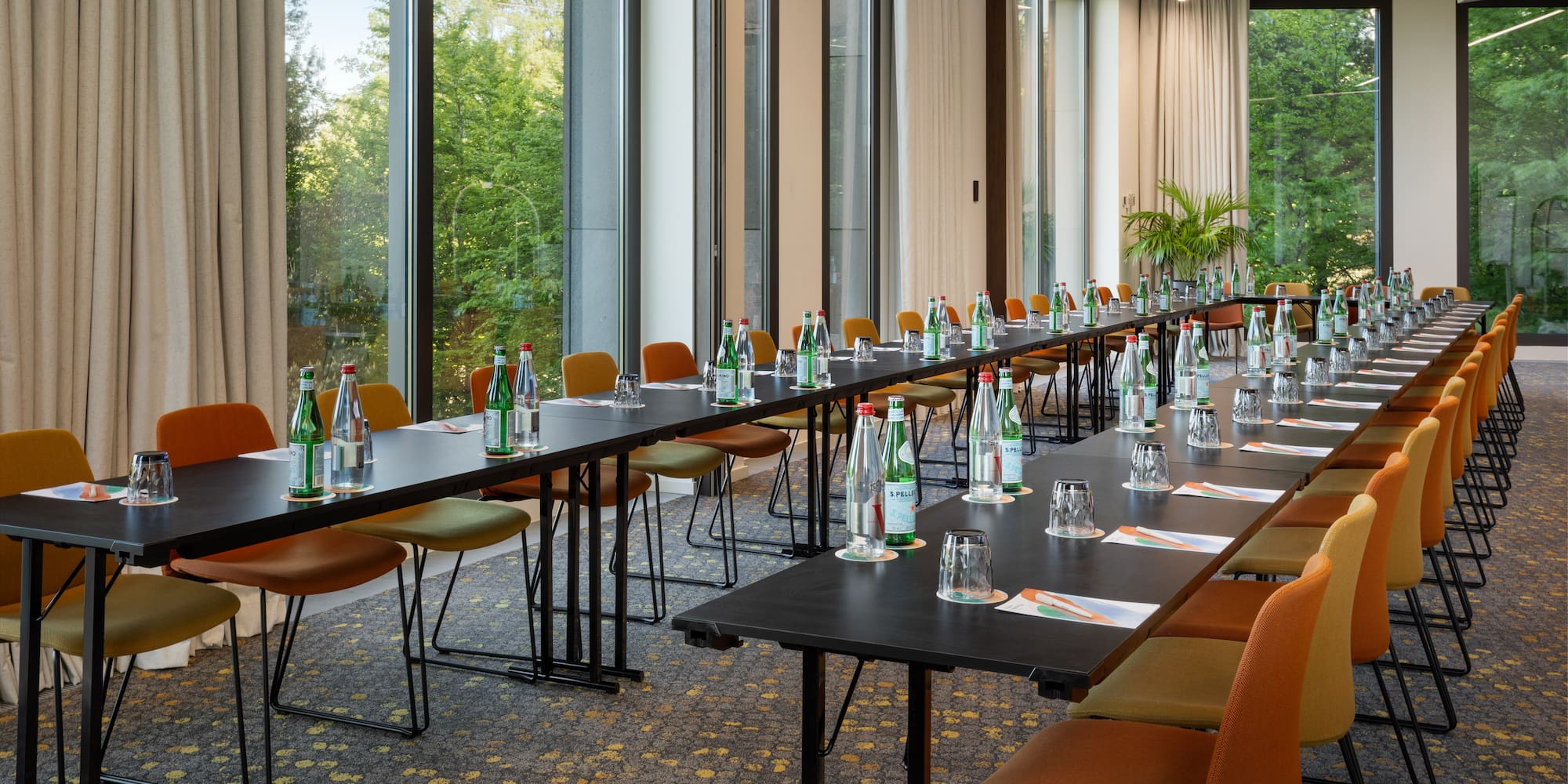 a long table with bottles and glasses on it