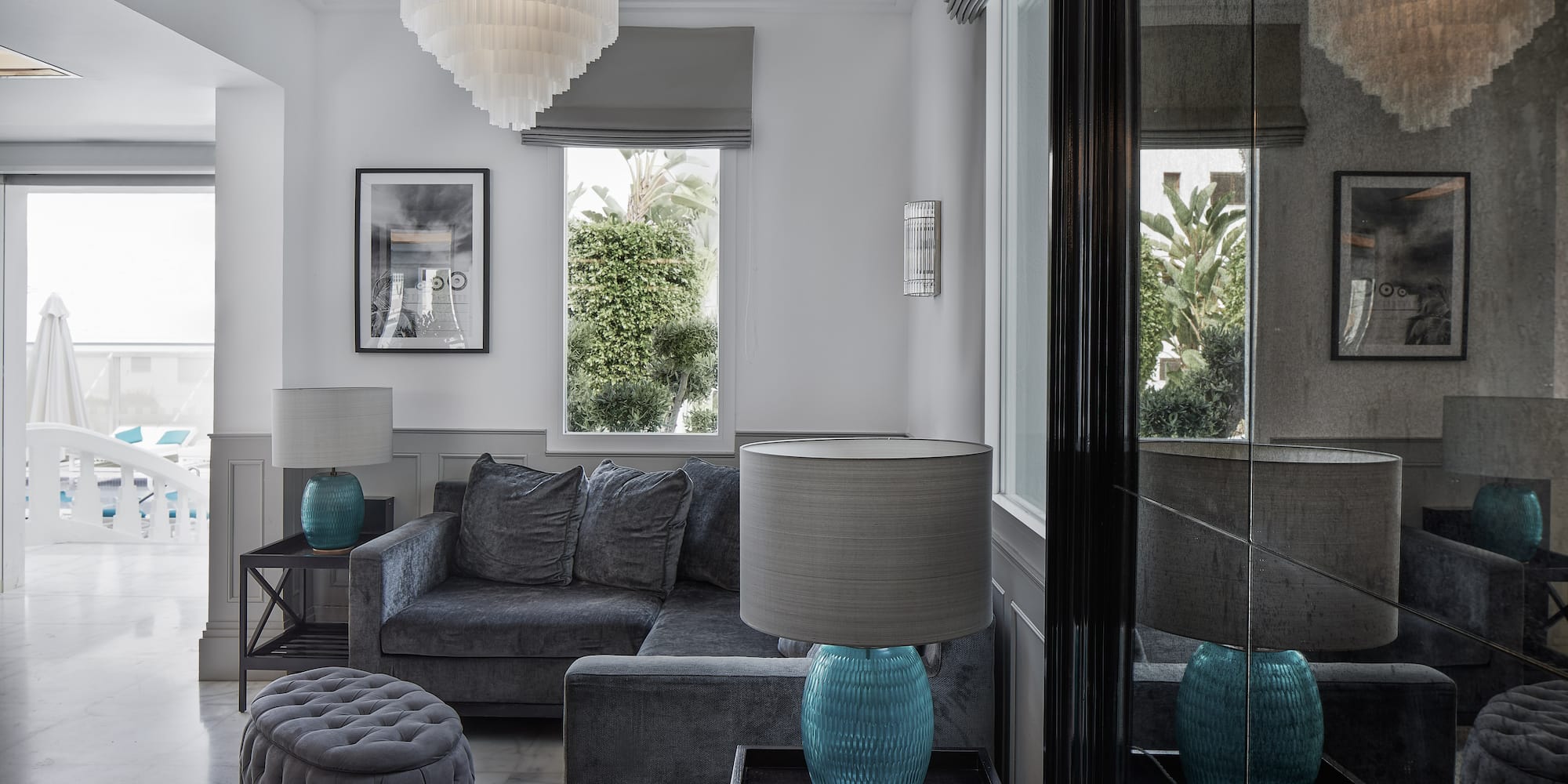 a living room with a couch and a lamp