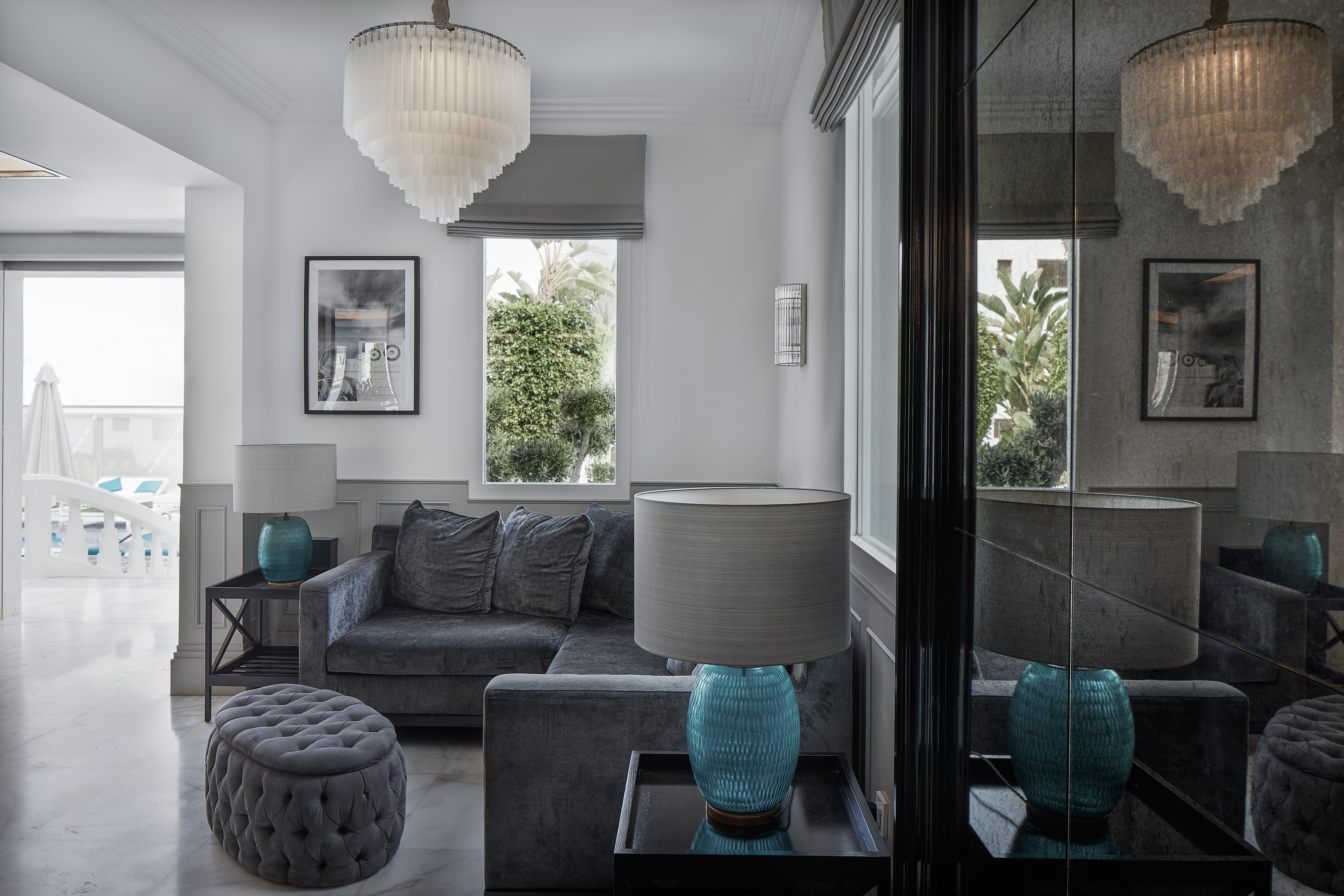 a living room with a couch and a lamp