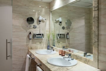 a bathroom with a large mirror and sinks