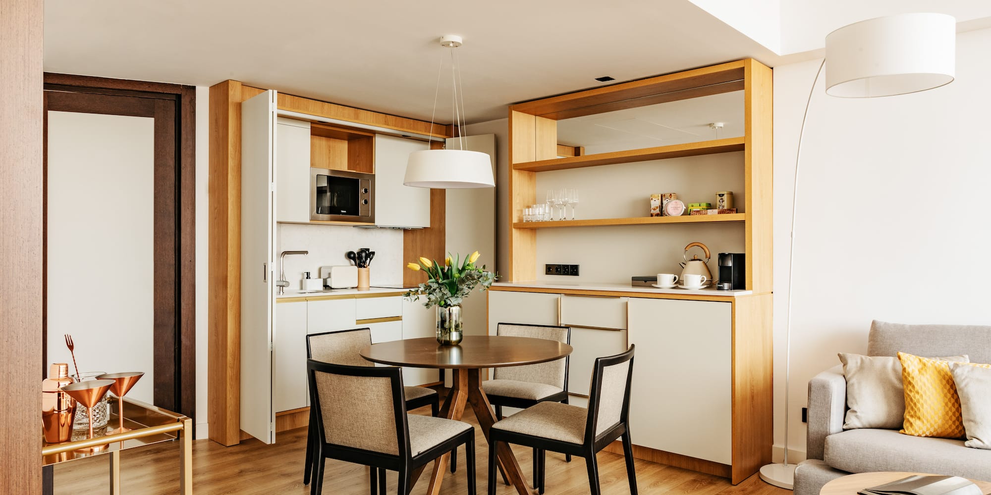 a dining table and chairs in a room