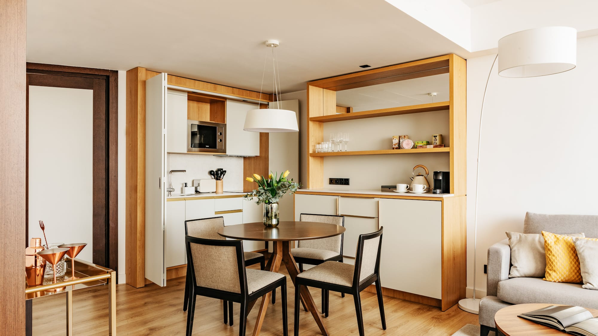 a dining table and chairs in a room