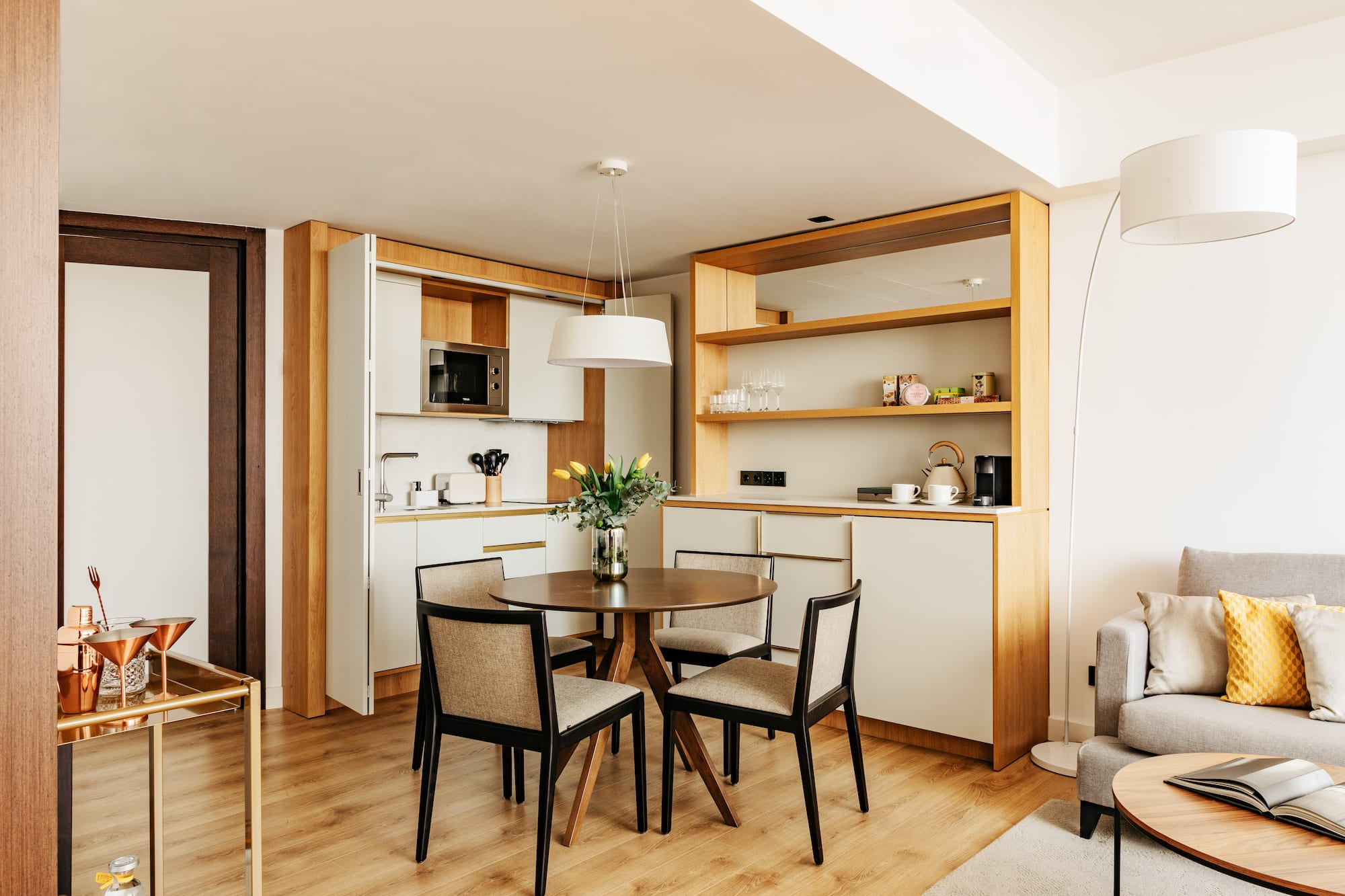 a dining table and chairs in a room
