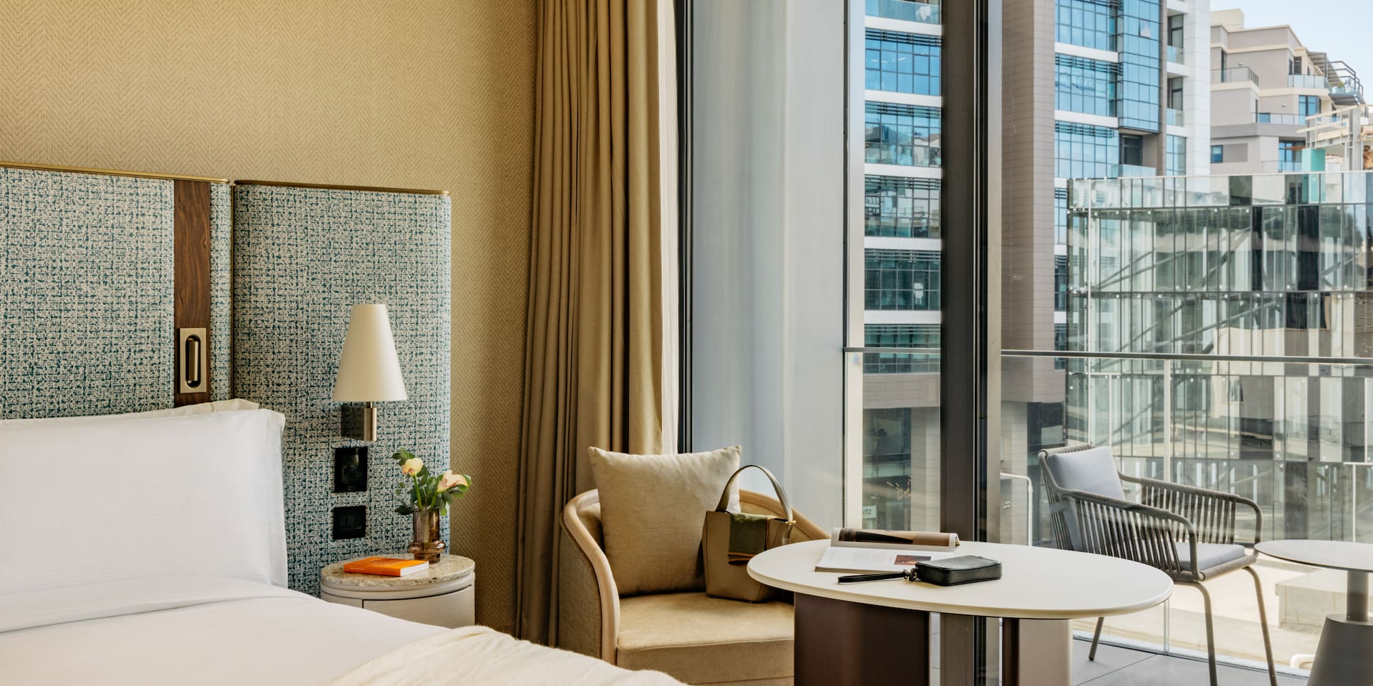 a hotel room with a window and a bed