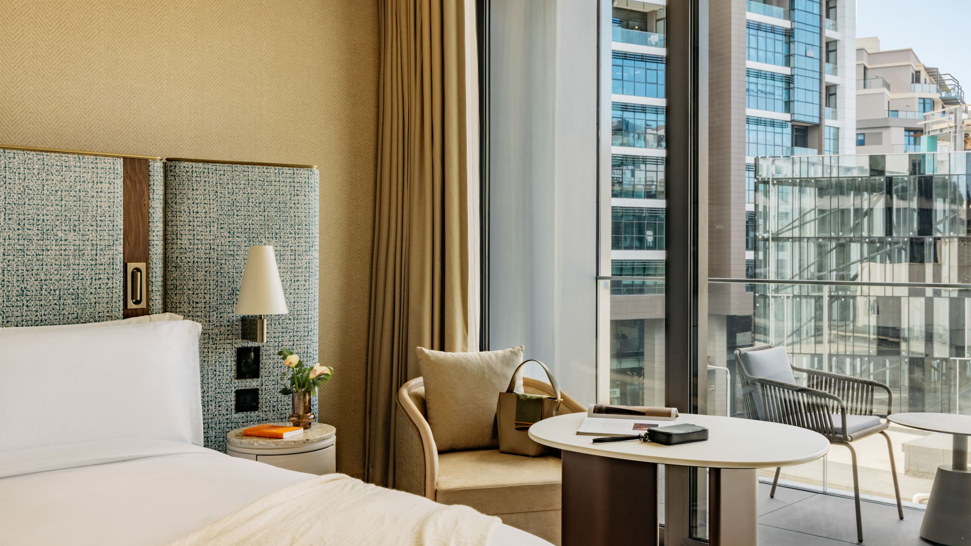 a hotel room with a window and a bed