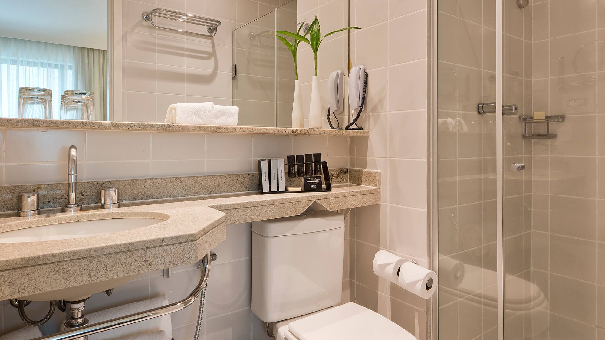 a bathroom with a shower and toilet
