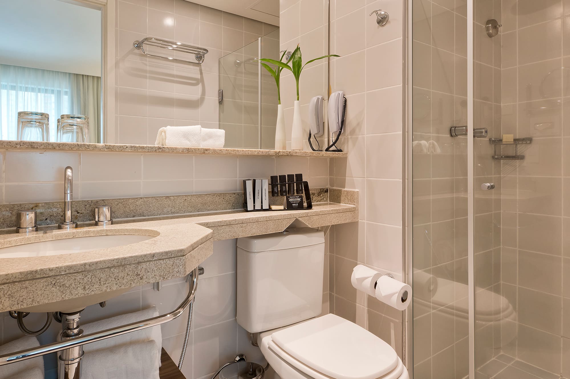 a bathroom with a shower and toilet