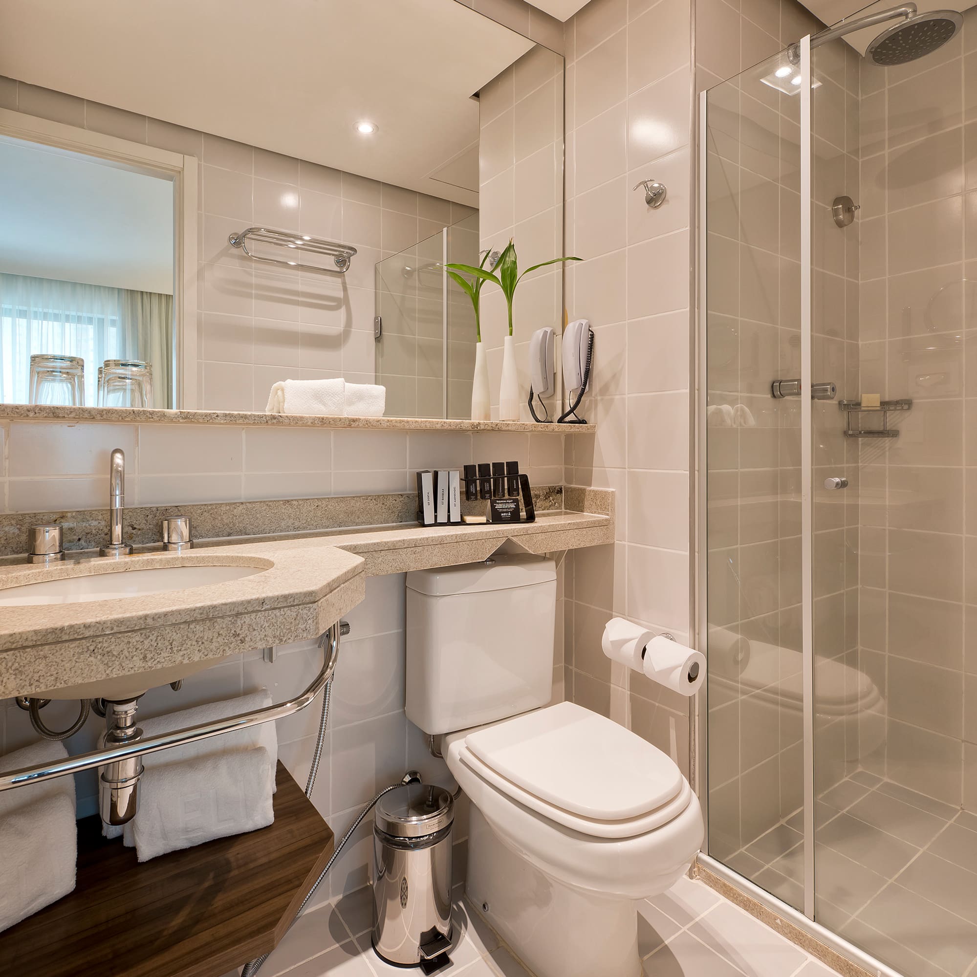 a bathroom with a shower and toilet