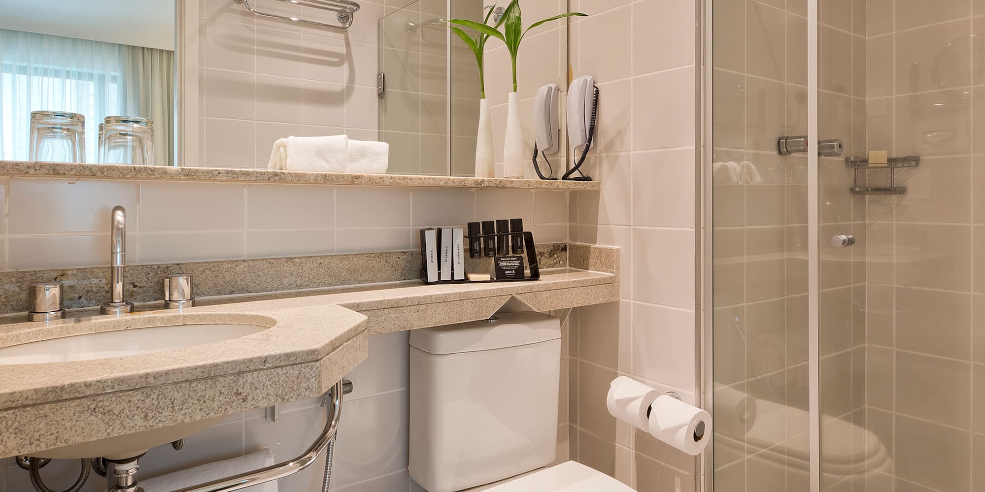 a bathroom with a shower and toilet