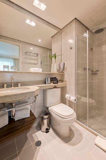 a bathroom with a shower and toilet
