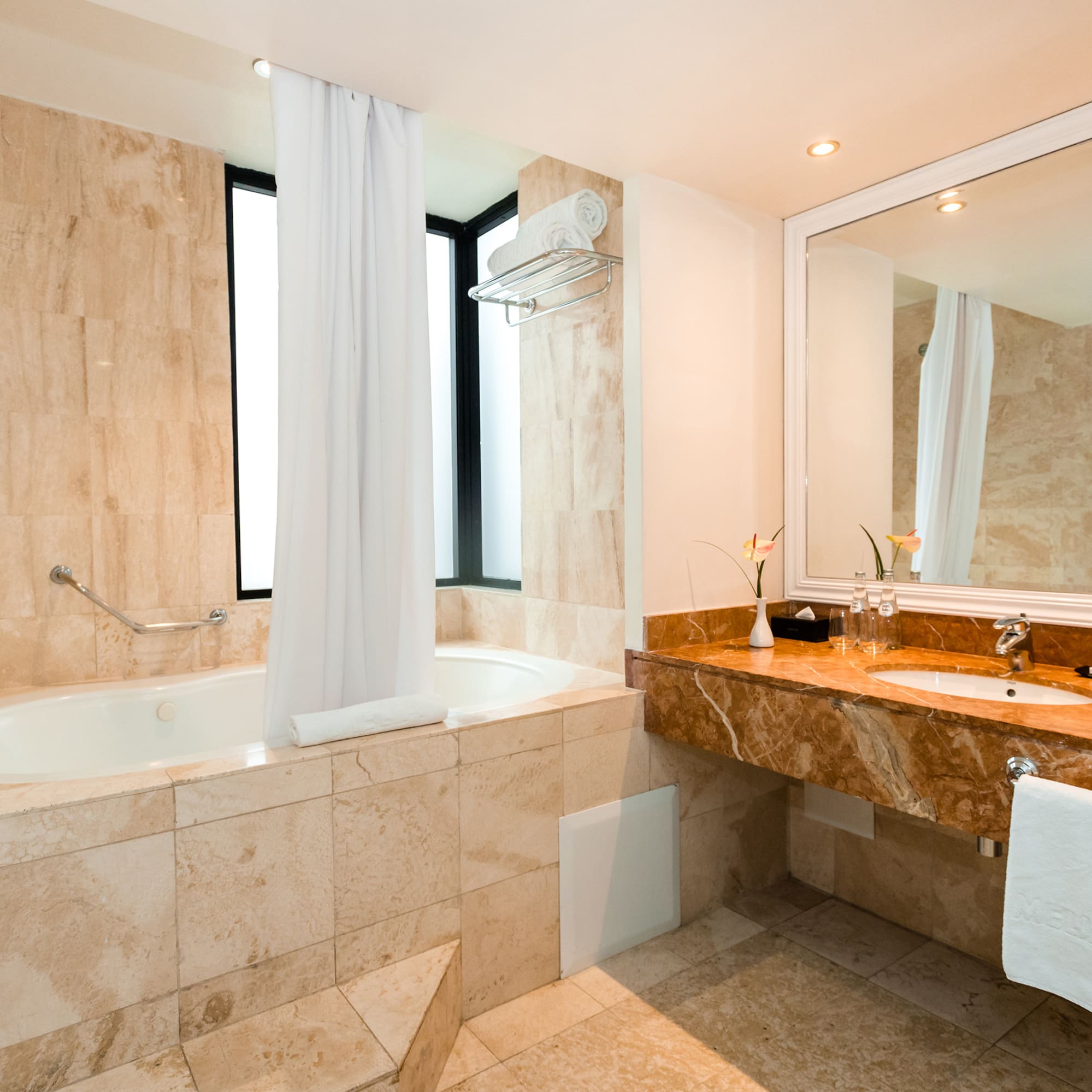 a bathroom with a tub and sink