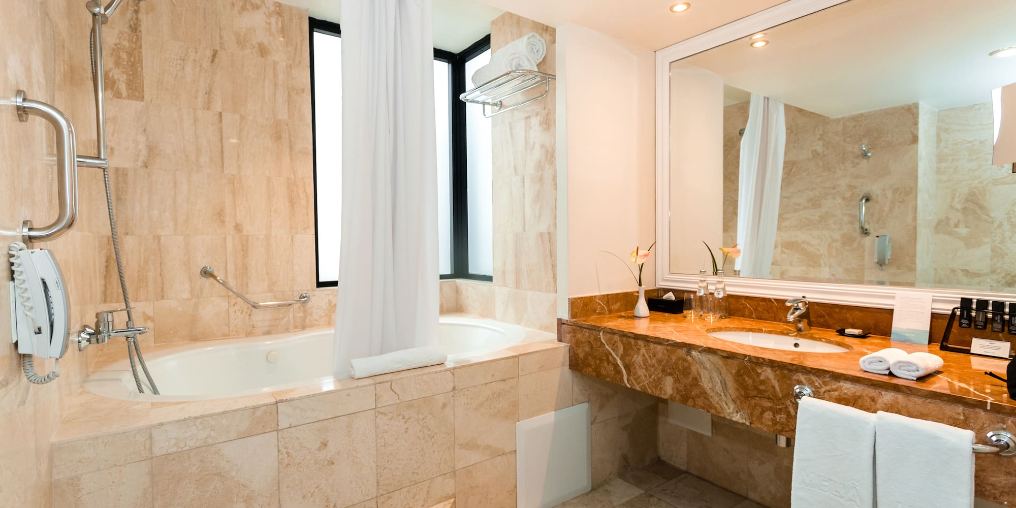 a bathroom with a tub and sink