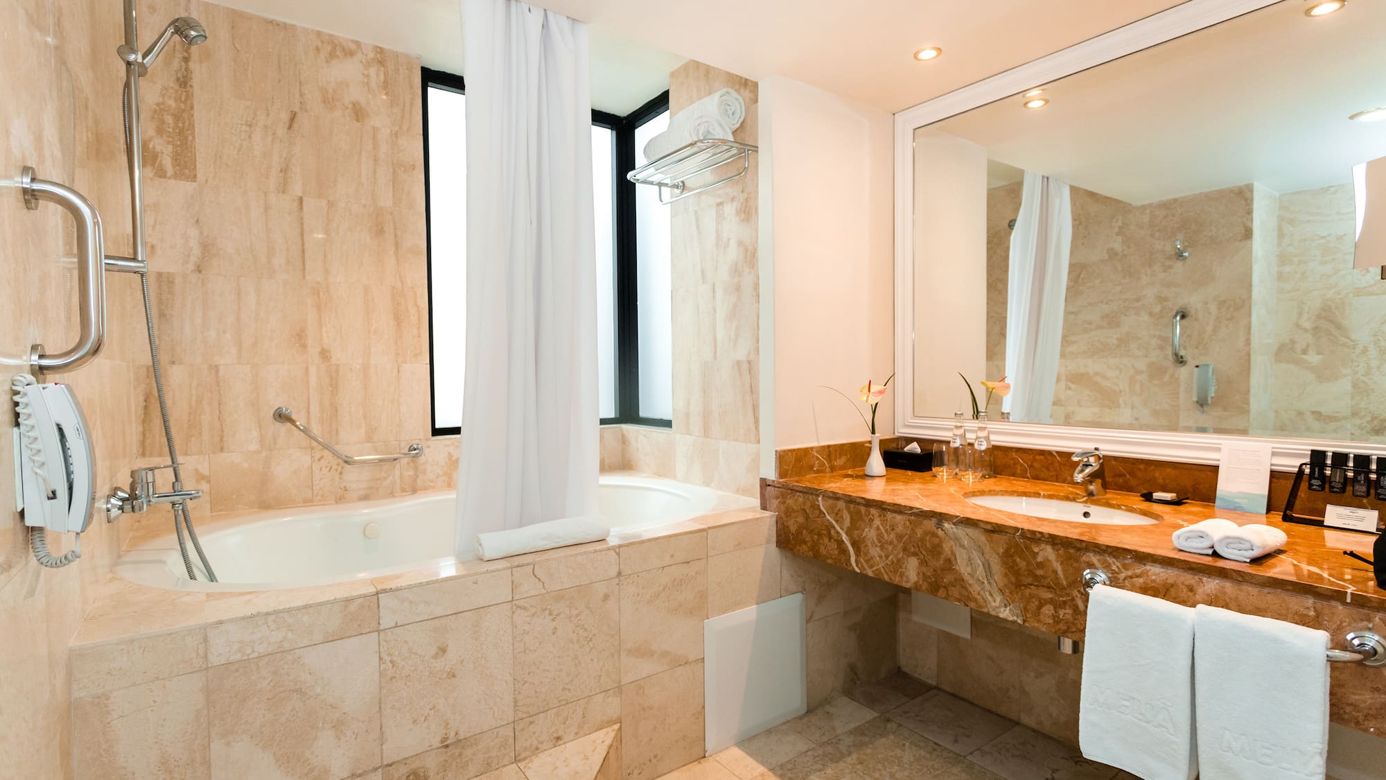 a bathroom with a tub and sink