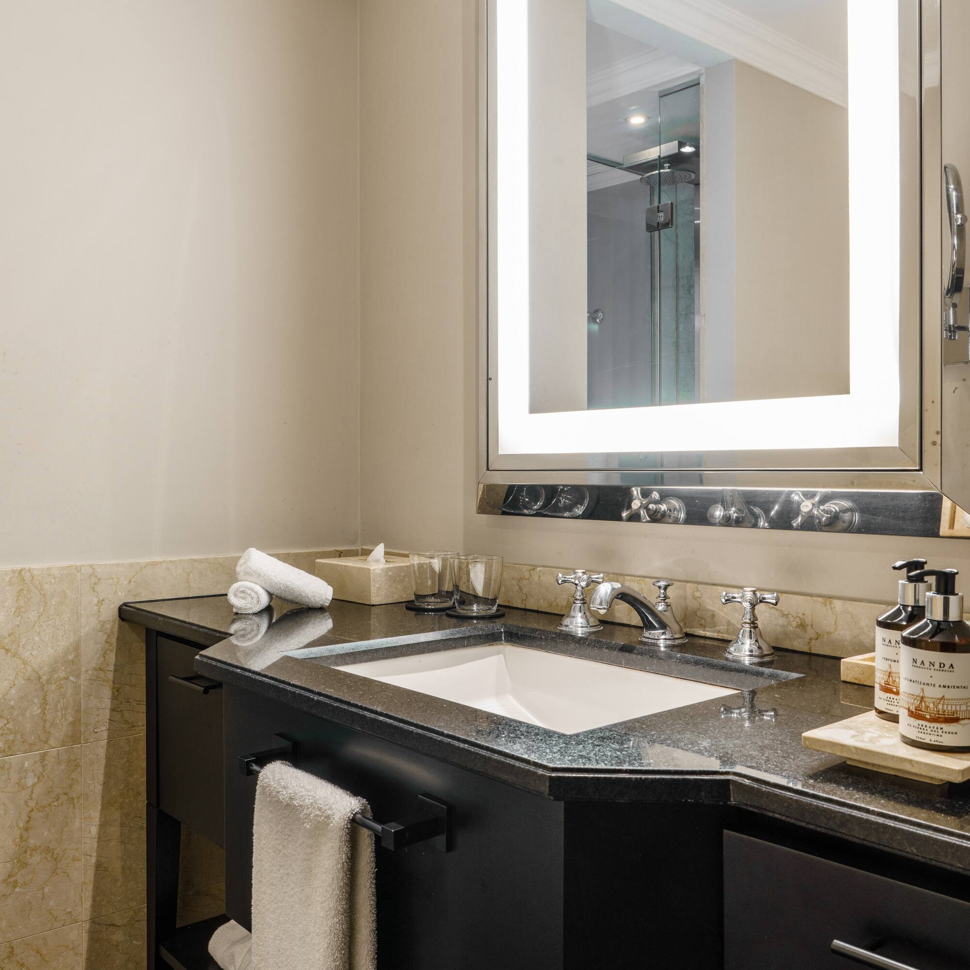 a bathroom with a mirror and sink