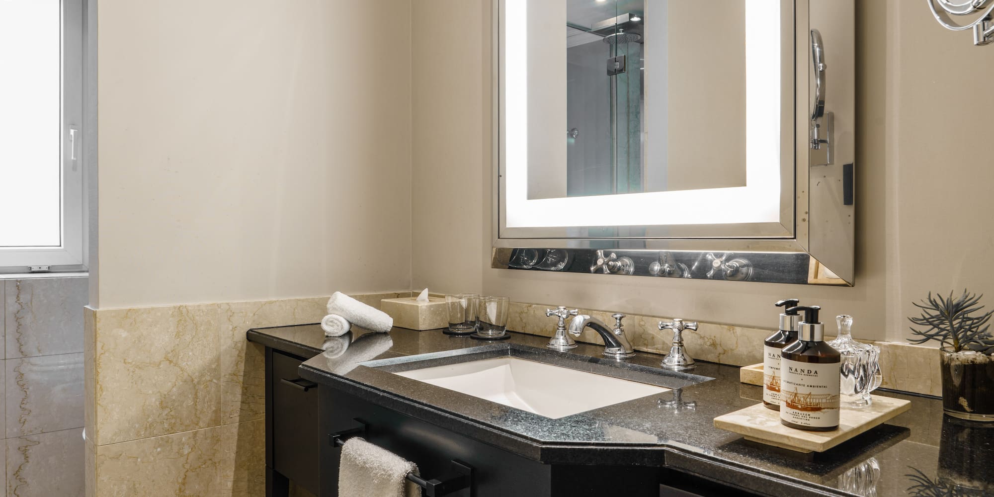 a bathroom with a mirror and sink