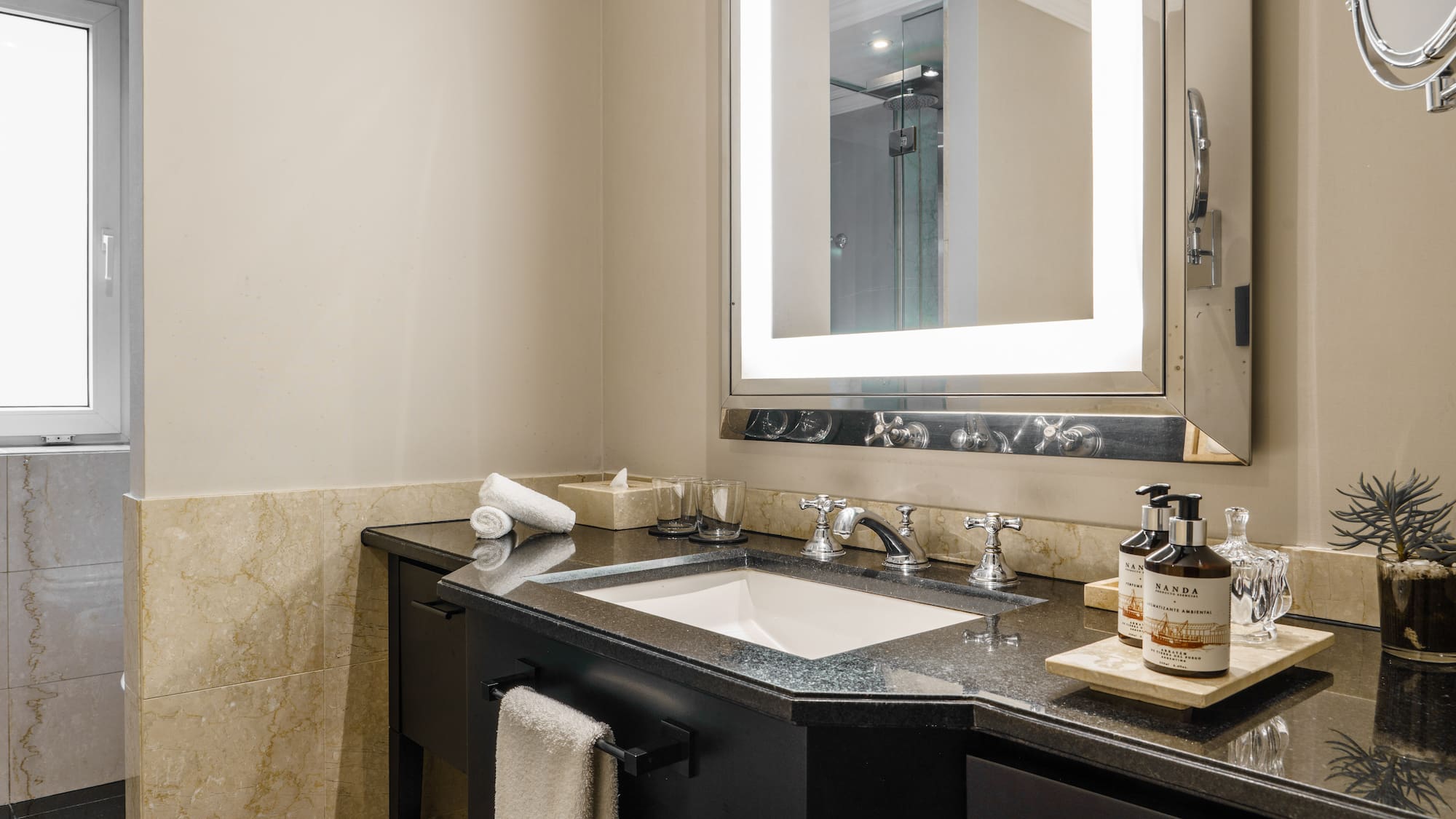 a bathroom with a mirror and sink