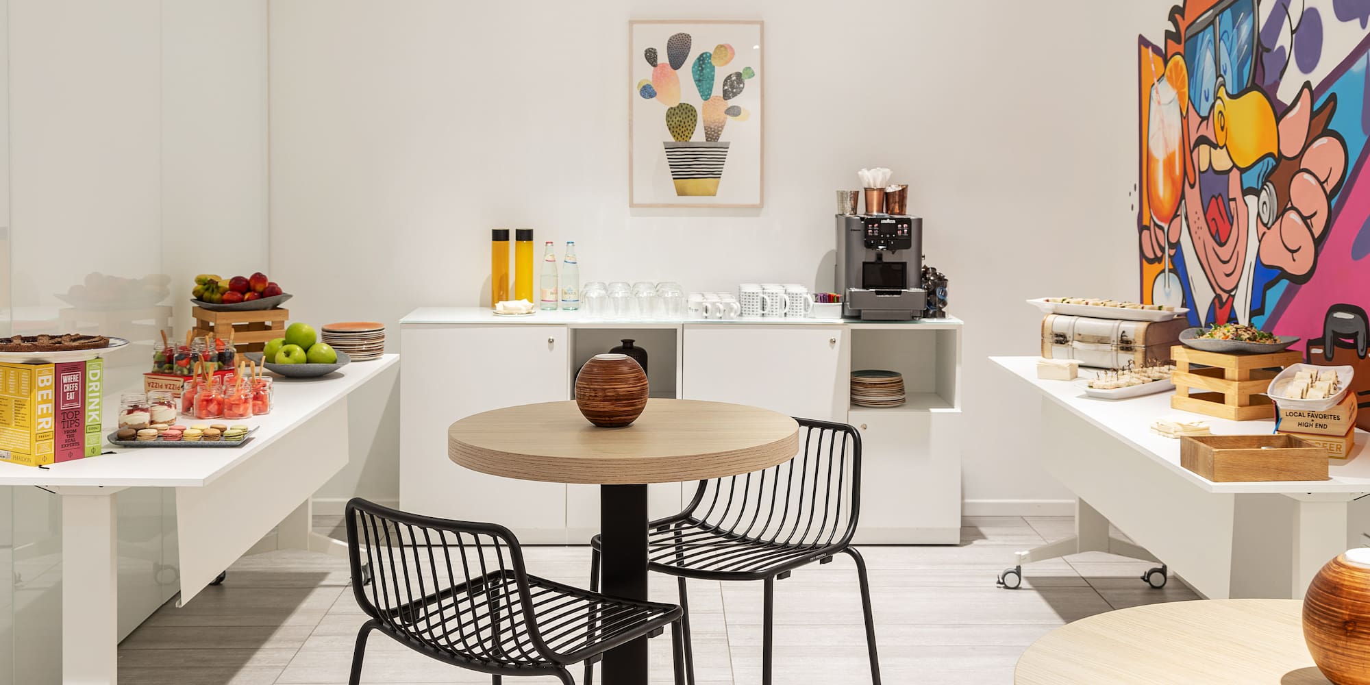 a room with white walls and a table and chairs