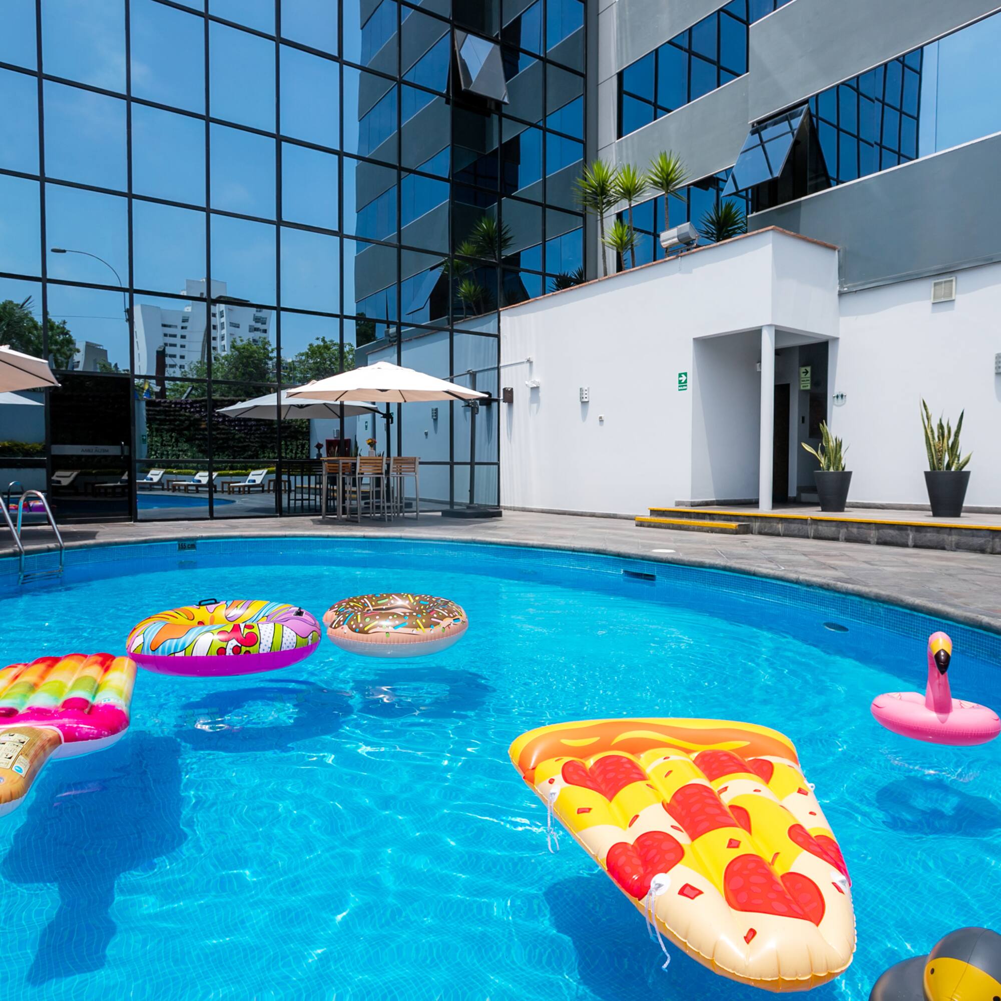 a pool with floating toys in it