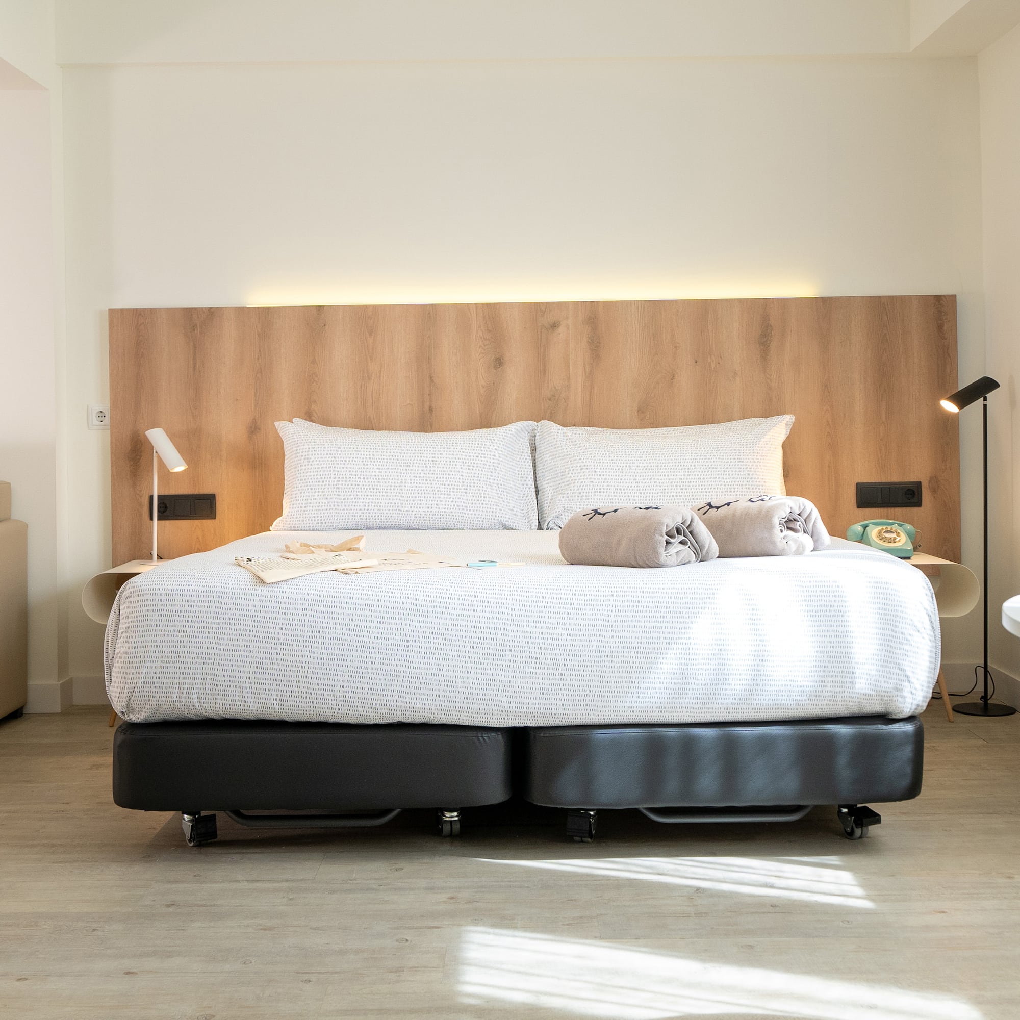 a bed with two pillows