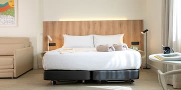 a bed with two pillows