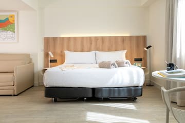 a bed with two pillows
