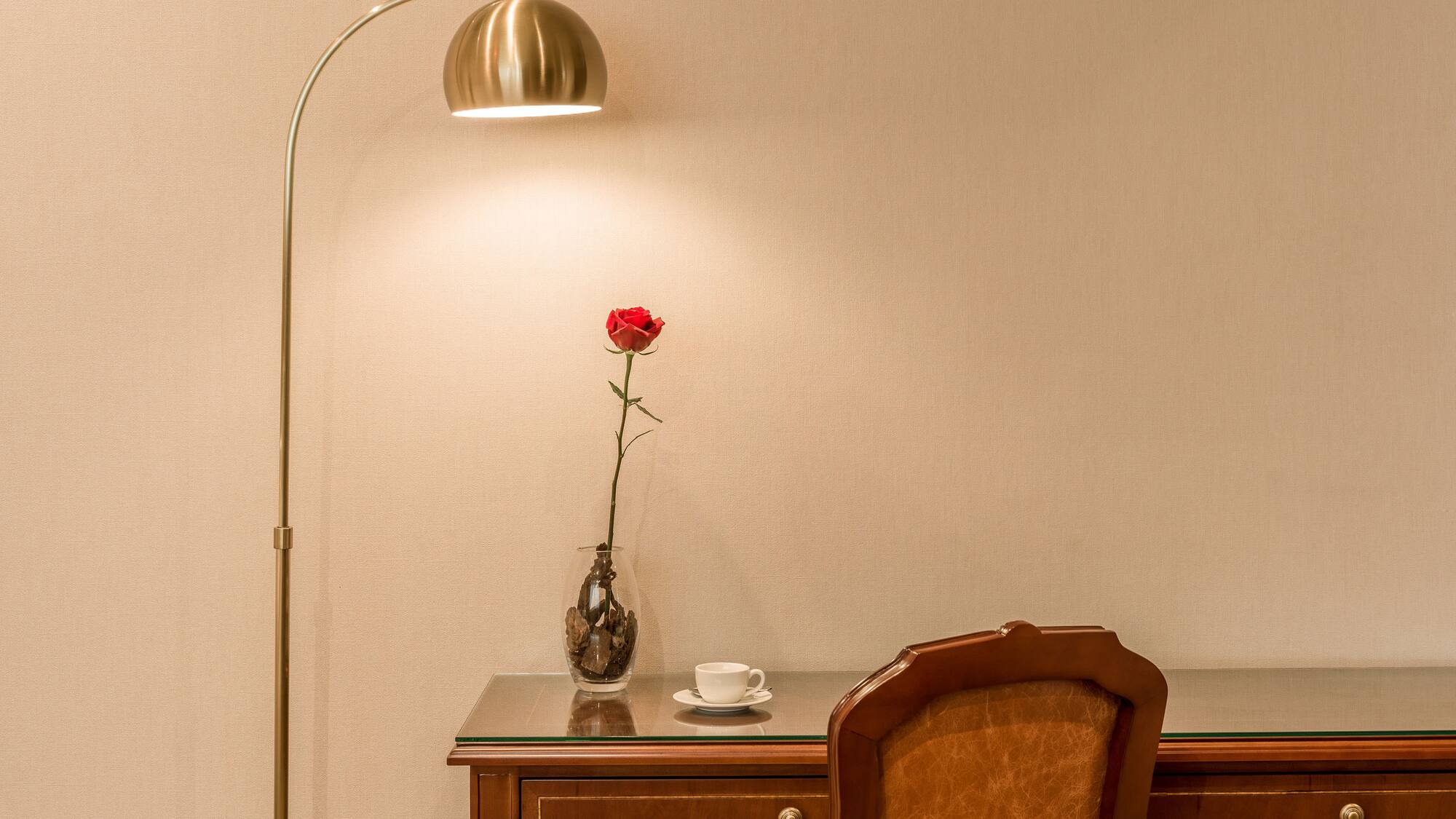 a lamp next to a desk