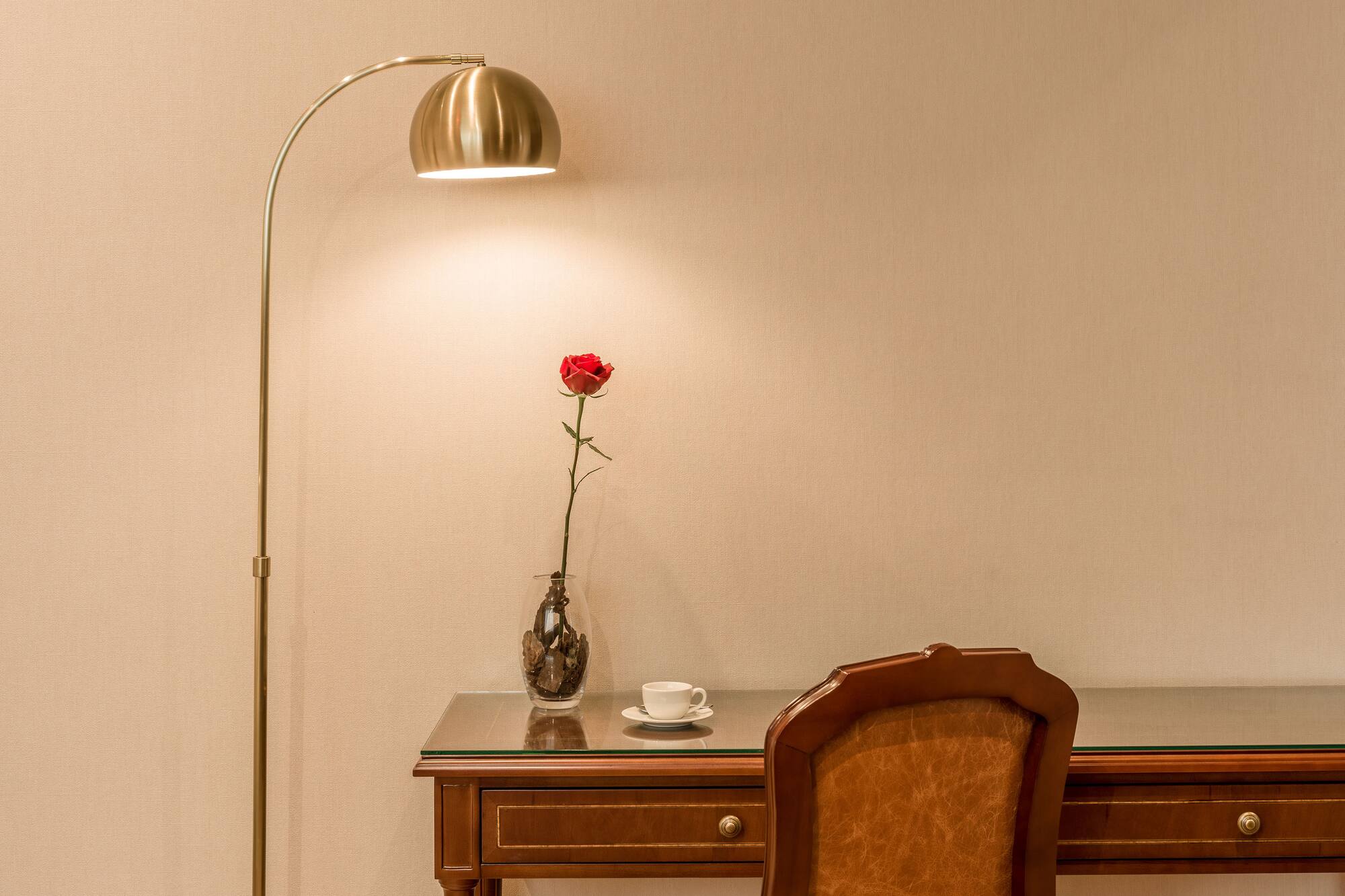 a lamp next to a desk