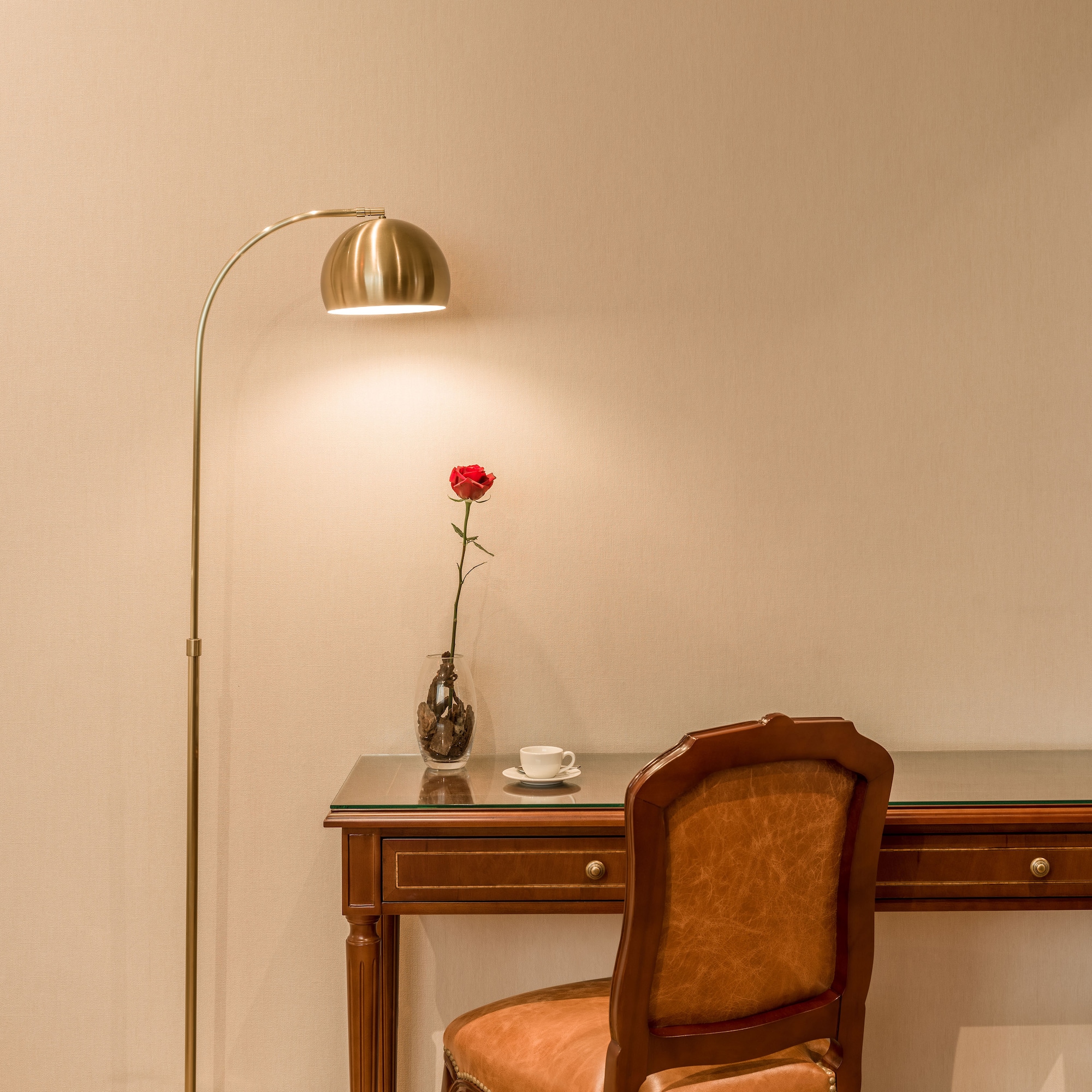 a lamp next to a desk