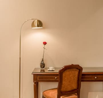 a lamp next to a desk