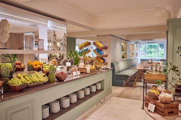 a room with a buffet and a table with food