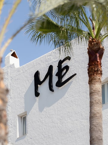 a building with palm trees