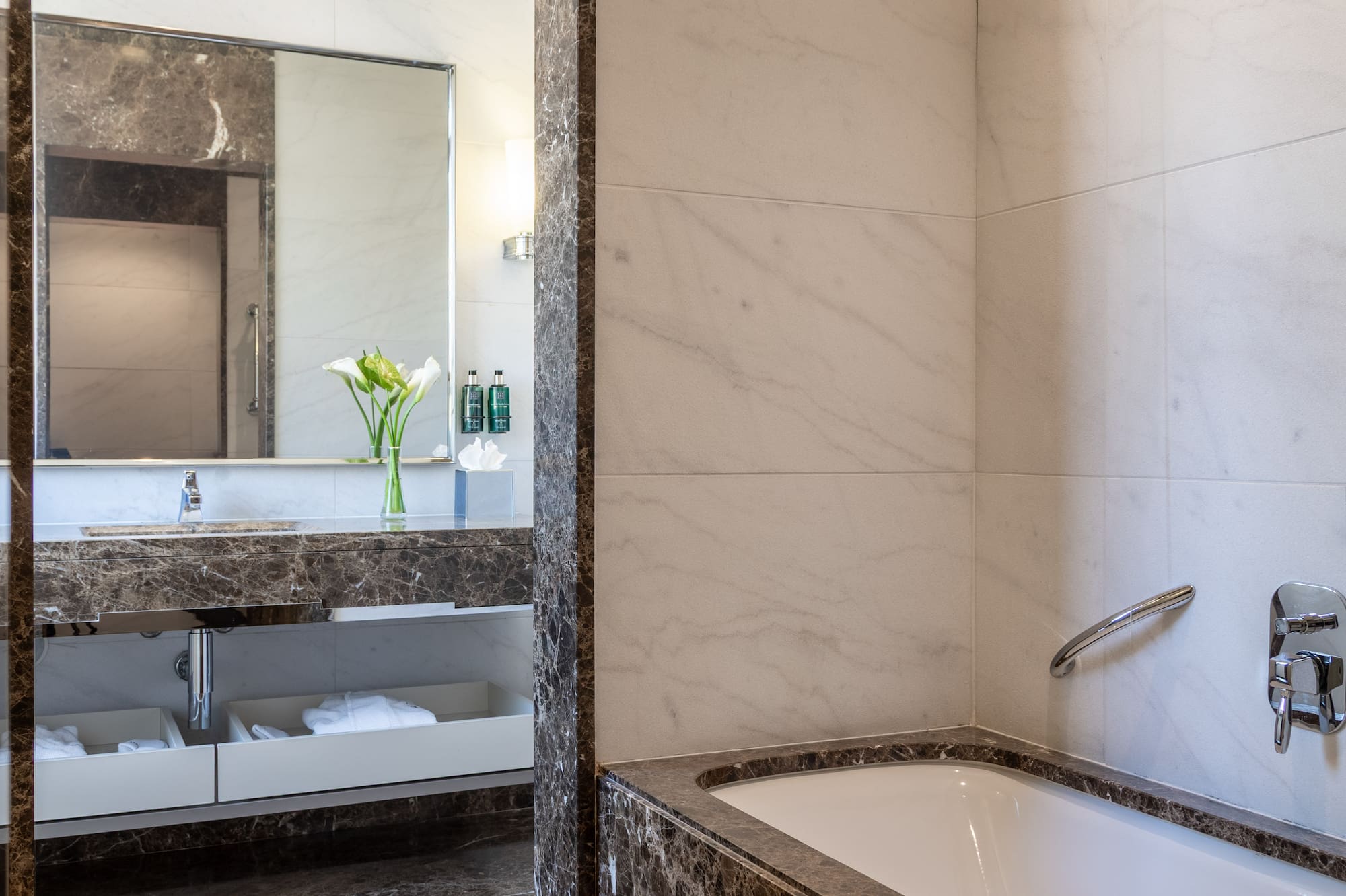 a bathroom with a bathtub and sink