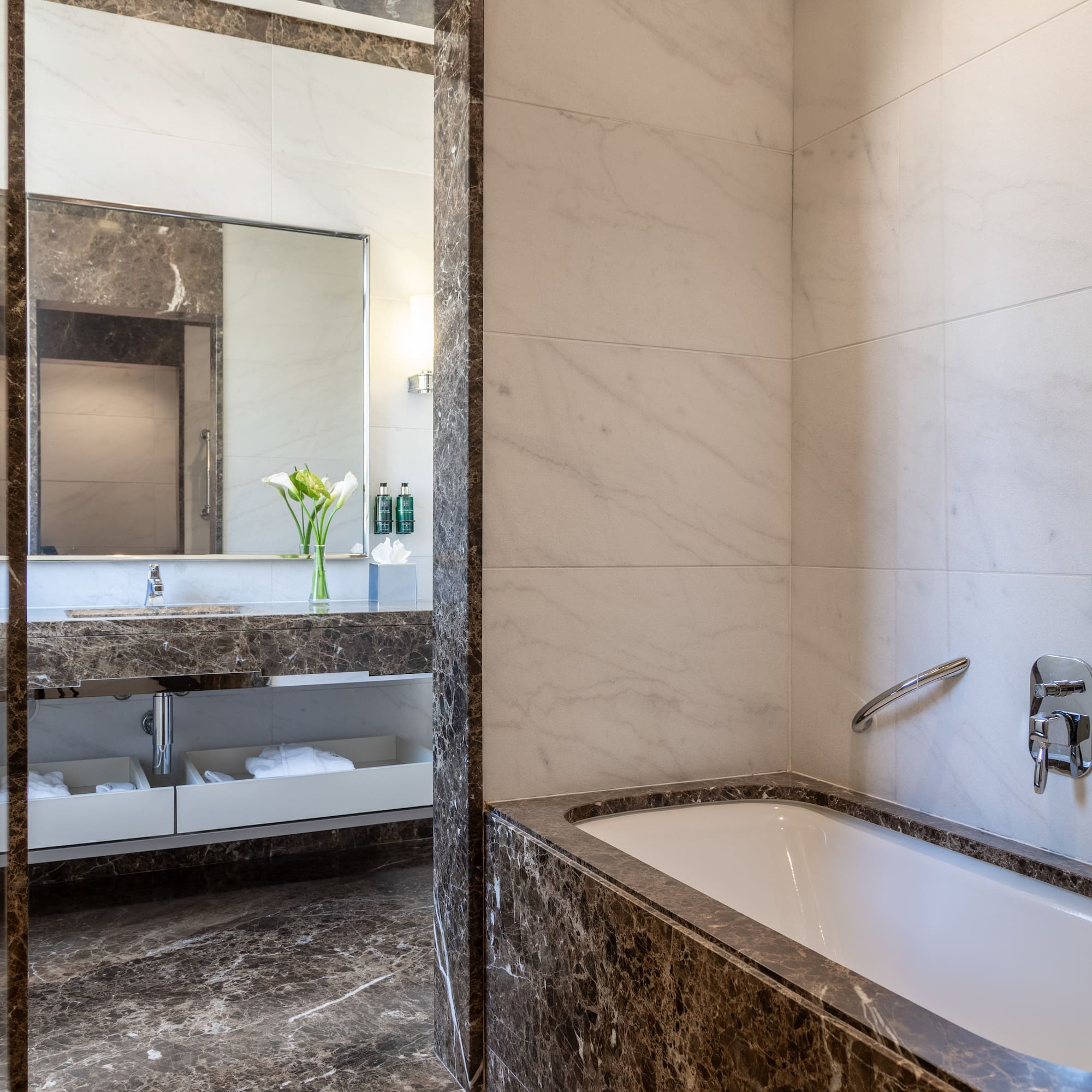 a bathroom with a bathtub and sink