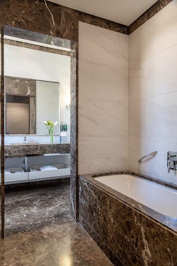 a bathroom with a bathtub and sink