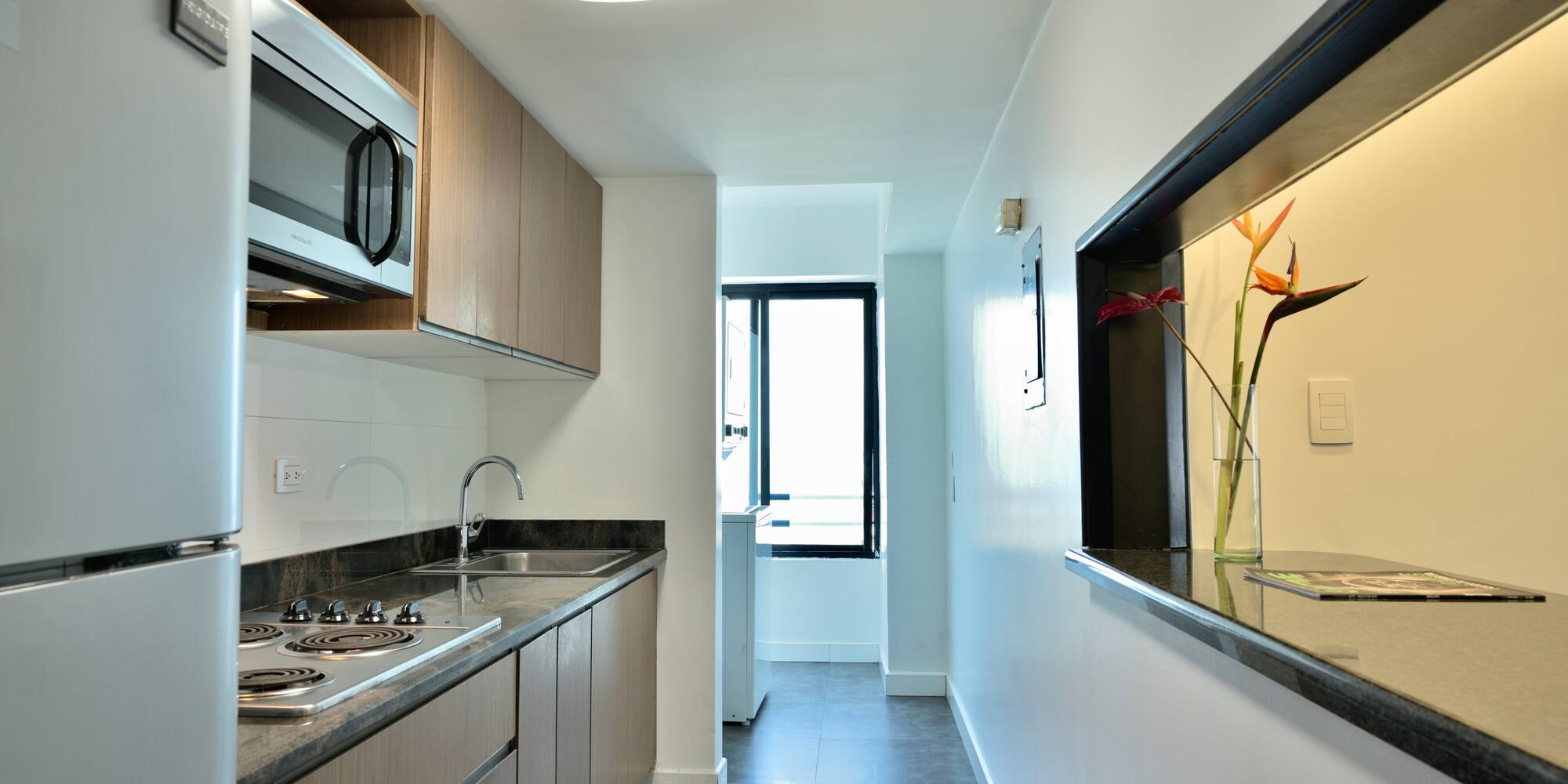 a kitchen with a sink and a microwave