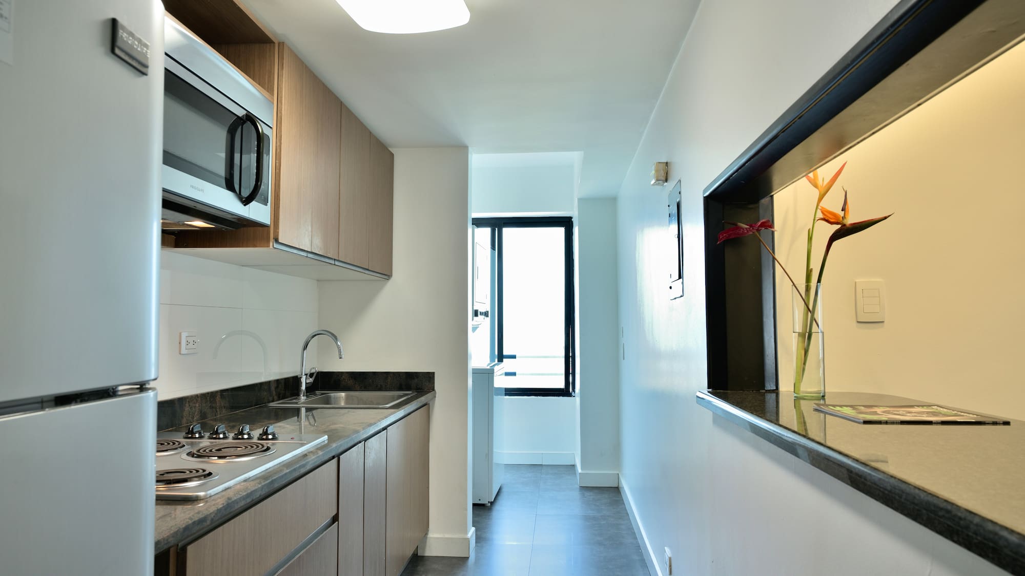 a kitchen with a sink and a microwave