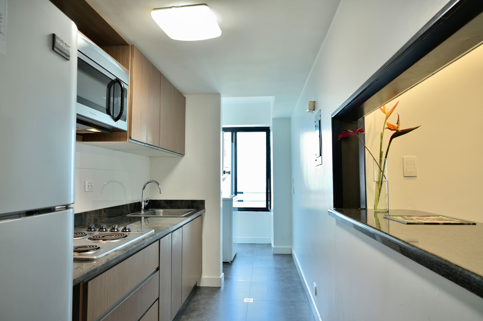 a kitchen with a sink and a microwave