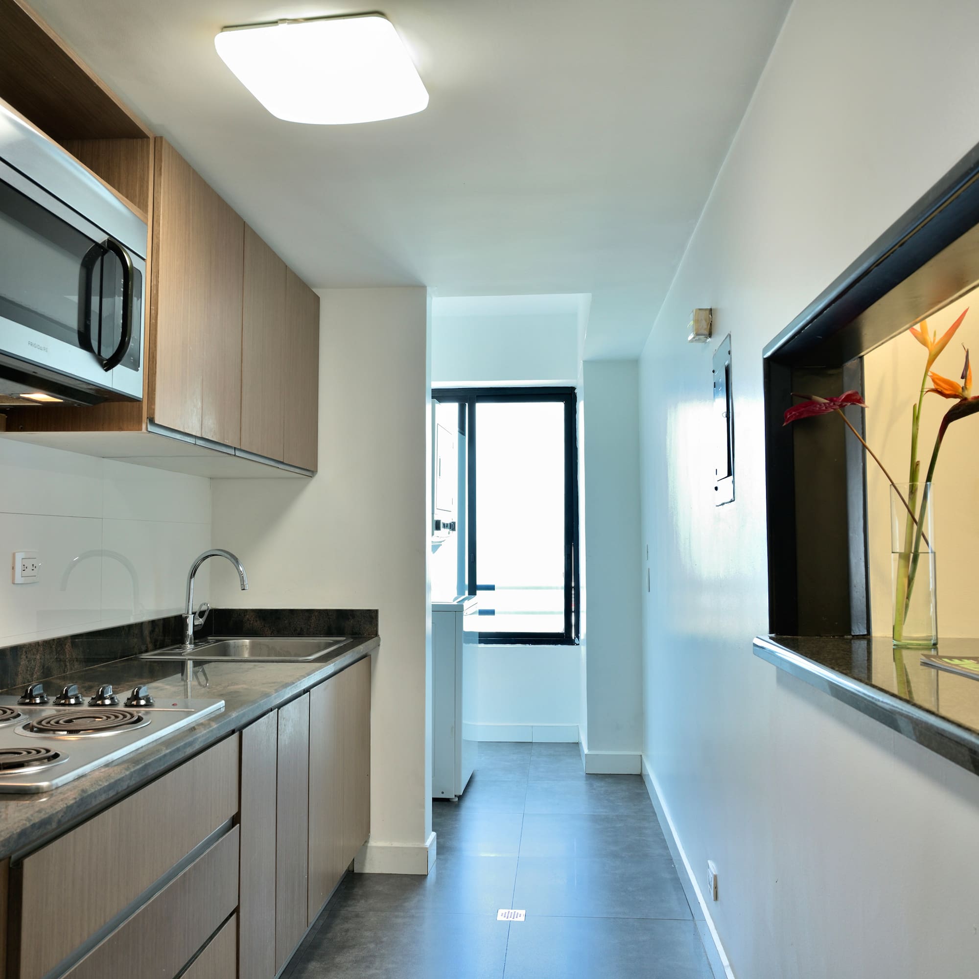 a kitchen with a sink and a microwave