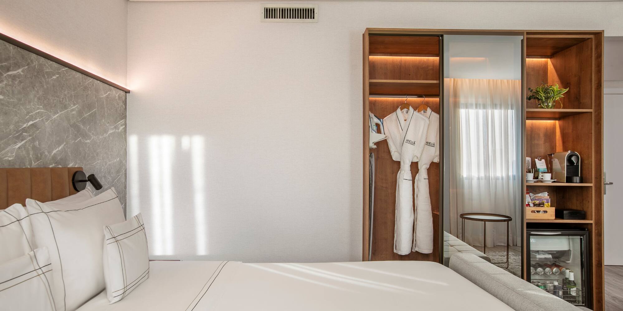 a room with a bed and a closet