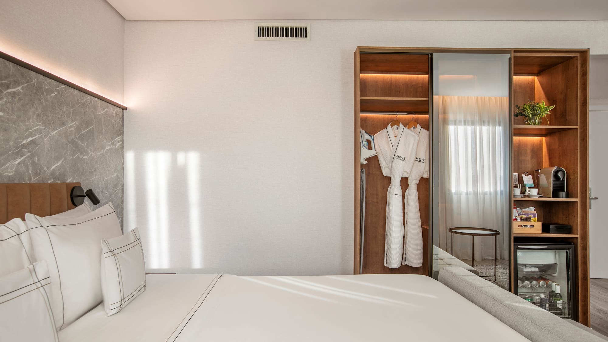 a room with a bed and a closet