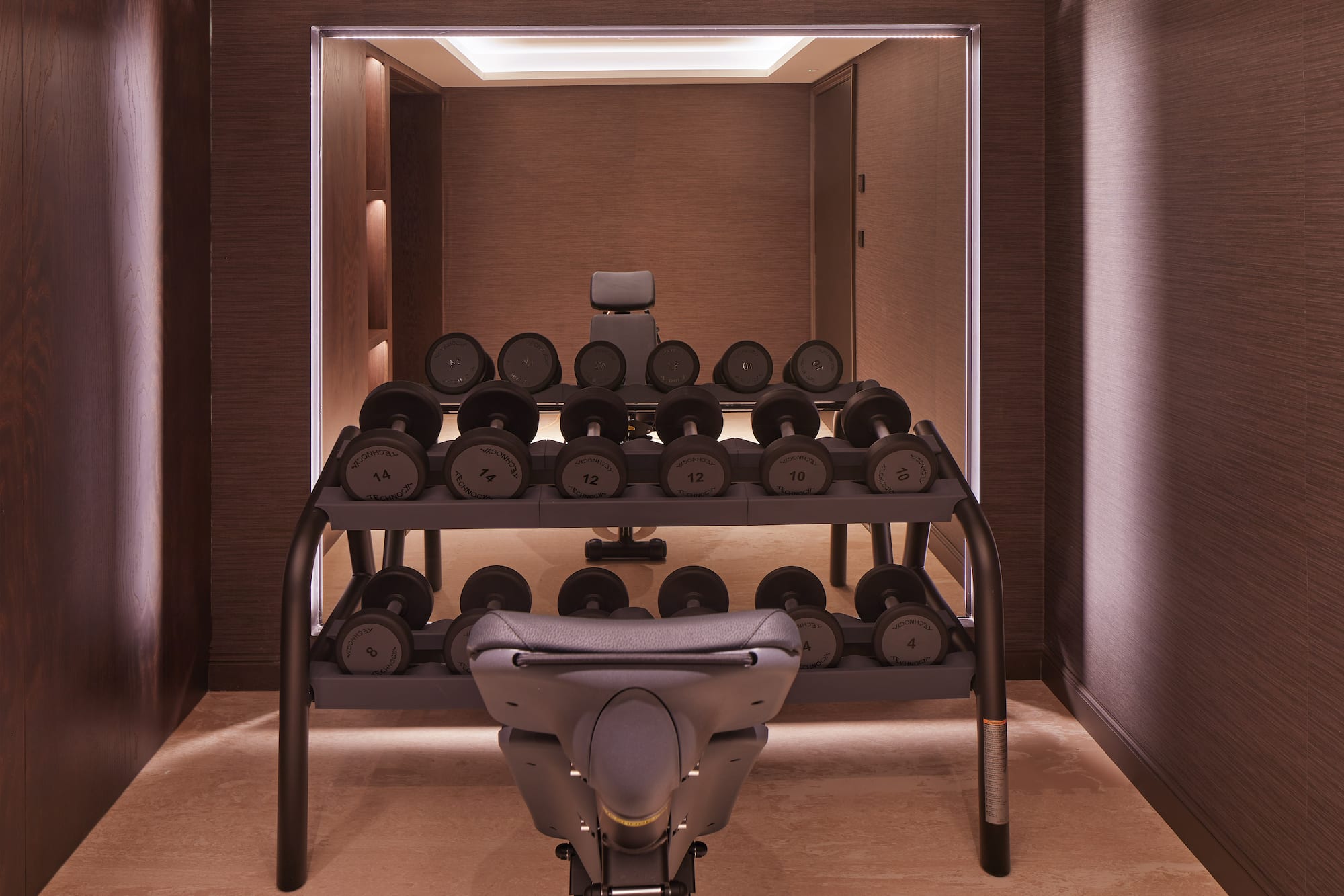a room with a rack of weights