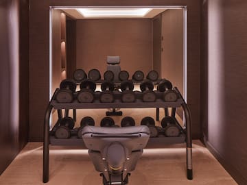 a room with a rack of weights