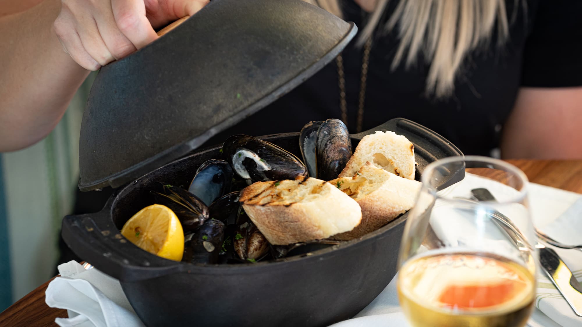 a bowl of seafood with a lid open